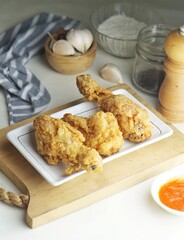 home made crispy kentucky fried chicken in a white background