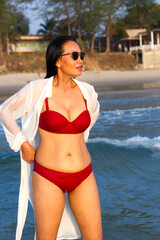 Obraz premium Woman body pretty with red bikini on beach