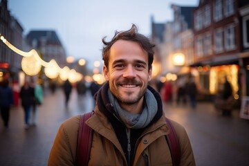 Handsome young man in the city at Christmas time, Holland