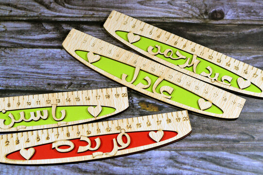 Translation of Arabic Names on rulers ( AbdulRahman, Yassin, Adel, Farida) Arabian common names on wooden rulers, a rule, line gauge, instrument used to make length measurements in centimeters