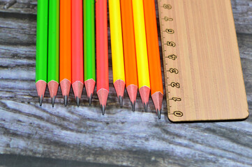 A ruler, rule, line gauge for length measurement and Row of pencils, a pencil is a writing or...