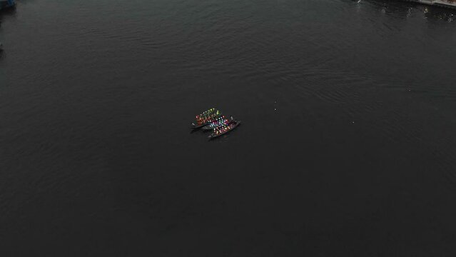 Boats on thu bon river at Hoi an old town Vietnam with laterns, aerial