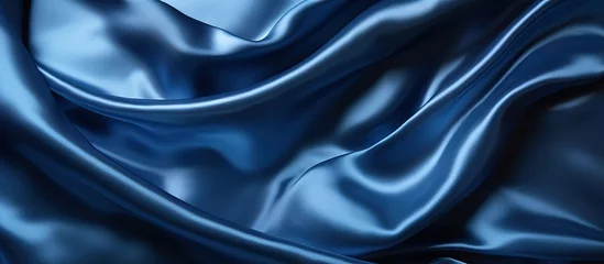 Fotobehang Luxury silk satin backdrop in dark blue shade Elegant shine and gentle creases Ideal for web banners and design Tabletop view perfect for Christmas and Valentine s Day © AkuAku