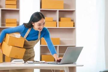 Asian woman people tackling warehouse tasks with dedication, realities of small web business management, e-commerce , dynamic world of small online business operations, efficient inventory management