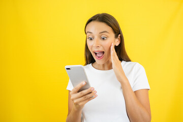 Surprised Woman Looking at Smartphone Earn Money Online Concept