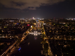 Fototapeta na wymiar Beautiful evening Amsterdam aerial view from above with narrow canals and old famous architecture.