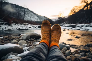 Fotobehang Thermal socks hanging outside a camping tent in a winter landscape, essential for keeping feet warm during outdoor activities © Davivd