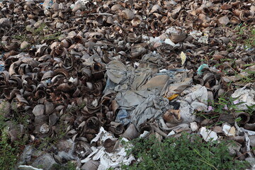 Dried coconut trash near a discarded car cover