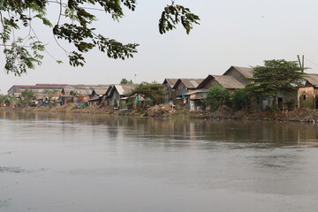 Inspeksi Kali Malang, Cikarang, Bekasi, Indonesia - September 22 2023: Slum houses on river banks are very vulnerable to flooding and dirty water