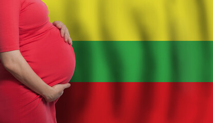 Pregnant woman belly on Lithuanian flag background