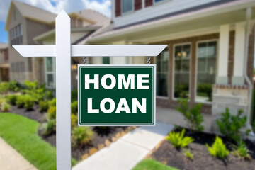 HOME LOAN sign against a house. Close-up.