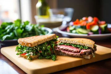 Foto op Canvas panini-style roast beef sandwich with fresh tabbouleh salad aside © altitudevisual