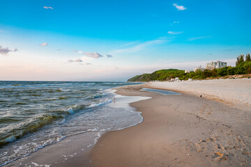 Beach near Misdroy in Poland. Natural coastal section on the Polish Baltic Sea. Landscape by the sea with wide sandy beaches.