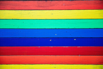 Colorful rainbow colors painted on old wooden planks