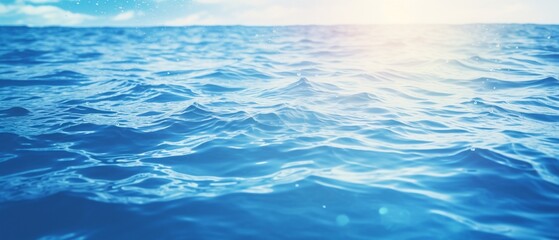 Obraz premium Summer Serenity: Beautiful Blurred Blue Background with Glistening Water Highlights, Evoking the Essence of Seaside Holidays