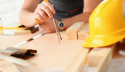 Arms of worker making structure plan on scaled paper closeup. Manual job DIY inspiration...