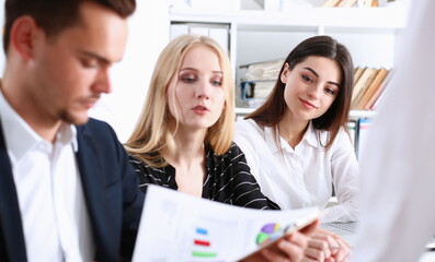 Obraz premium Group of people hold silver pen ready to make note in clipboard pad sheet closeup. Training course university practice homework school or college exercise secretary table management concept