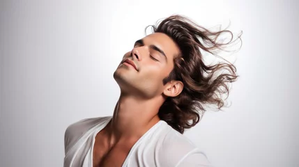 Poster Im Rahmen Cosmetic Advertising: Handsome Man with Wind-Blown Wavy Brown Hair © raulince