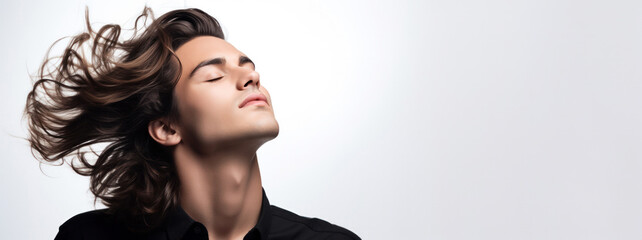 Fototapeta premium Cosmetic and Beauty: Muscular Male Model with Wind-Swept Wavy Hair