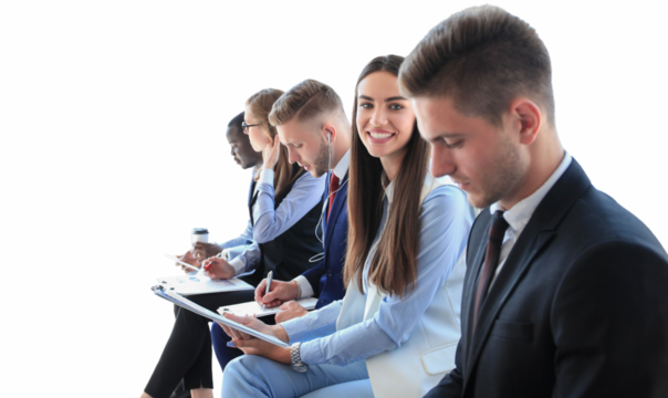Smiling businesswoman looking at camera at seminar with her colleagues near by on a transparent background