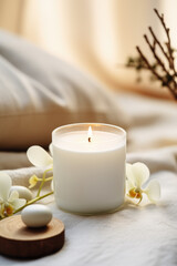 Obraz na płótnie Canvas Luxury lighting aromatic scented glass candle display on the grey table in the white bedroom