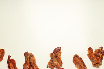 Tasty breakfast and delicious meat food concept - fried bacon