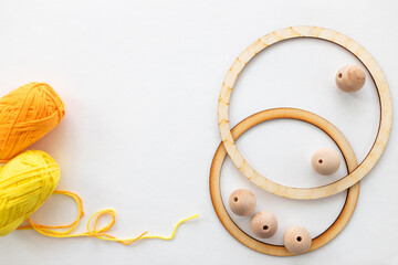 Workshop of weaving a dreamcatcher. Wooden ring, deads, threads to make dreamcatcher. Creating...