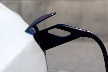 macro shot of an electric vehicle charger: a step towards eco-friendly driving