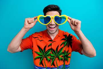 Portrait of funky ecstatic guy with bristle wear tropical shirt touching heart sunglass staring at...