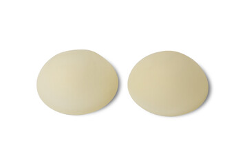 Female breast implants on a white background