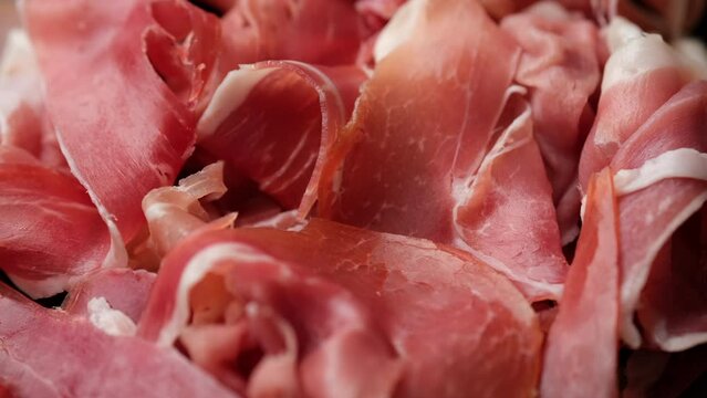 Jamon Serrano or Iberico macro, rotation. Spanish ham pork for tapas