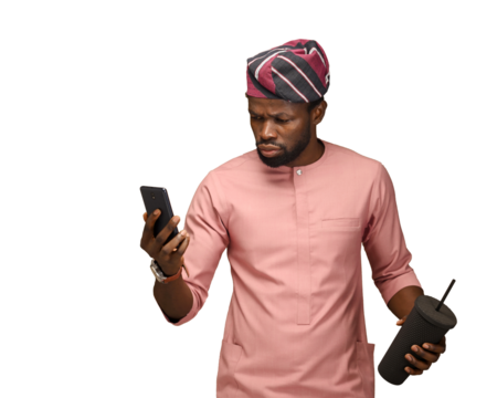 African American carrying a fancy cup reacting to email, Portrait on an isolatable brown studio backdrop