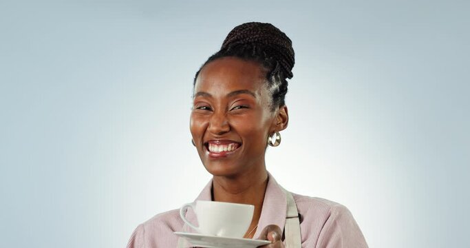 Waitress woman, coffee and face in studio for drink, choice or show with smile by blue background. African girl, happy and portrait for giving tea cup, matcha or espresso at cafe, restaurant or shop