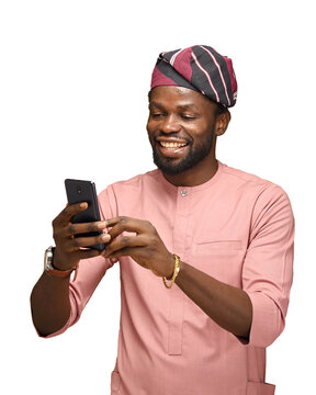 PNG image of a Happy African guy with a mobile phone looking at a smartphone with excitement open copy space. Transparent Background