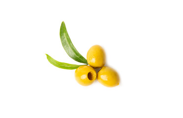 Delicious green olives isolated on white background. Olive and olive tree branches on a white table. Delicacy.
