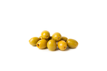 Delicious green olives isolated on white background. Olive and olive tree branches on a white table. Delicacy.