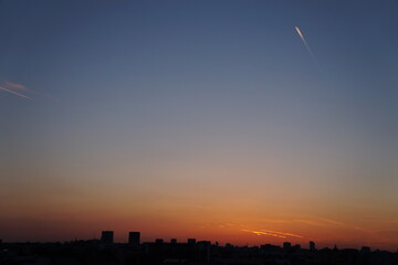 Obraz premium Bucharest skyline at sunset, sunrise sky with clouds. Purple sunset over Bucharest city