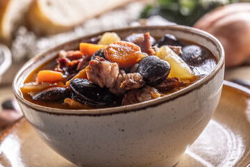 Traditional bean soup made from big beans, smoked neck, potatoes, and carrots