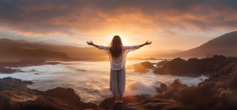 Successful woman with arms up on the beach with his arms up showing the ocean raising hands to the sky.