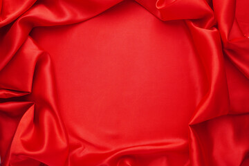 Elegant red satin or silk In the middle there was an empty space. (Focus on the center of the image)