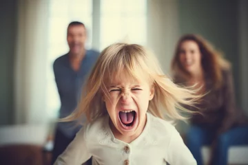 Fotobehang Portrait of angry little girl screaming in front of her parents at home © Anna