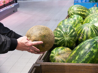 person holding a watermelon