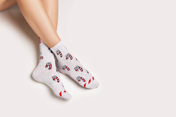 Woman legs in christmas socks