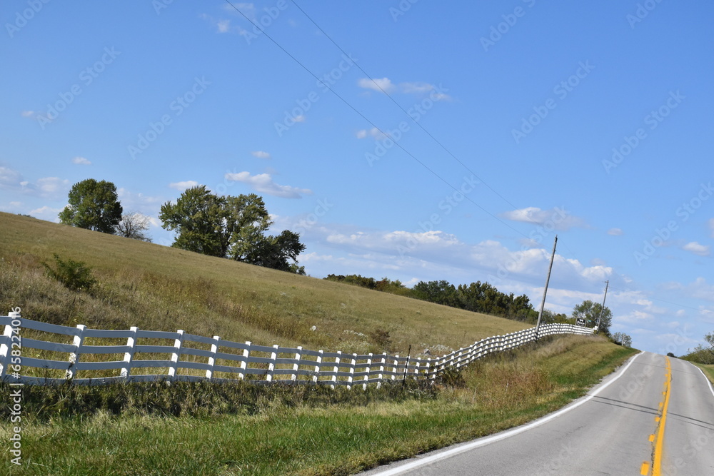 Sticker Fence Row in a Field by a Highway