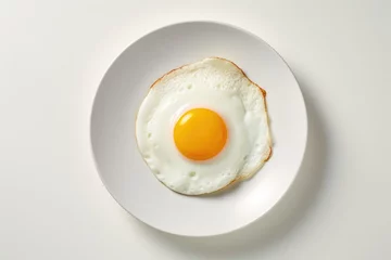 Foto op Canvas One fried egg on white plate isolated on white background, top view © DenisNata