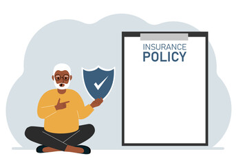 A man holds an insurance policy sign in his hands. The concept of life insurance, property or natural disasters.