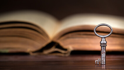 Old key with an opened book. Top secret, confidential or classified banner, background.