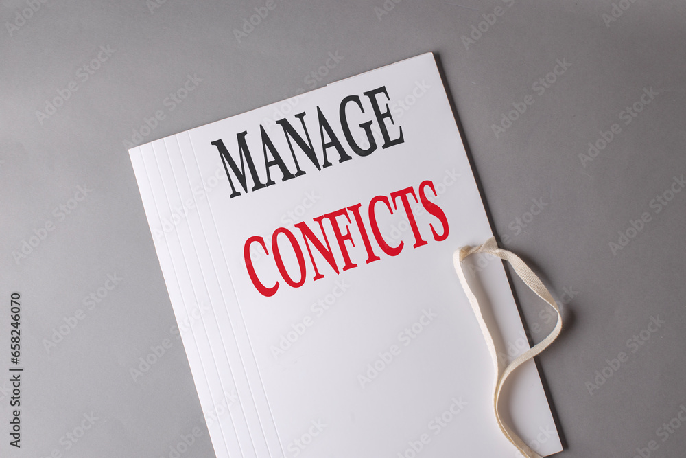 Aufkleber manage conflicts text on white folder on grey background