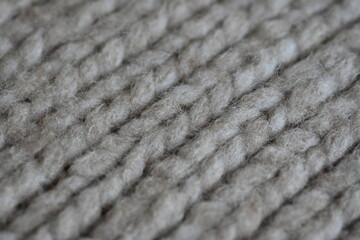 Large brown texture of face fabric as a background, knitted texture of sweater as a background