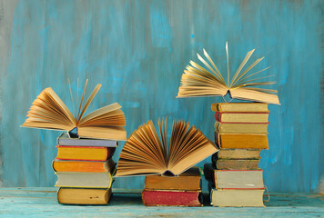 Stack of books with 3 open books, international book fair, reading, learning, education or home...